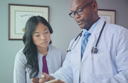 A male and a female doctor consulting