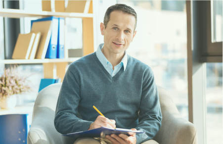 man smiling in office