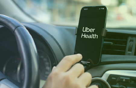 uber health app shown on cell phone in car
